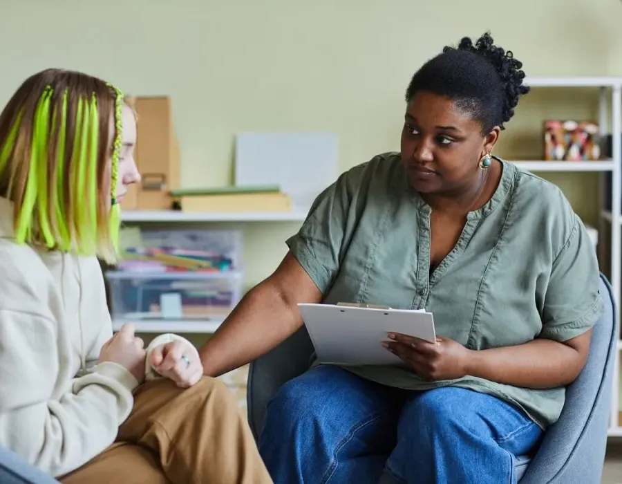 Social Worker Speaking with Young Client